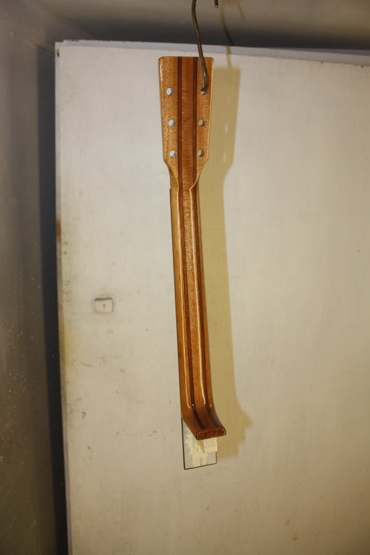 The neck is sprayed with 5 coats rubbing between coats and flatting before the last